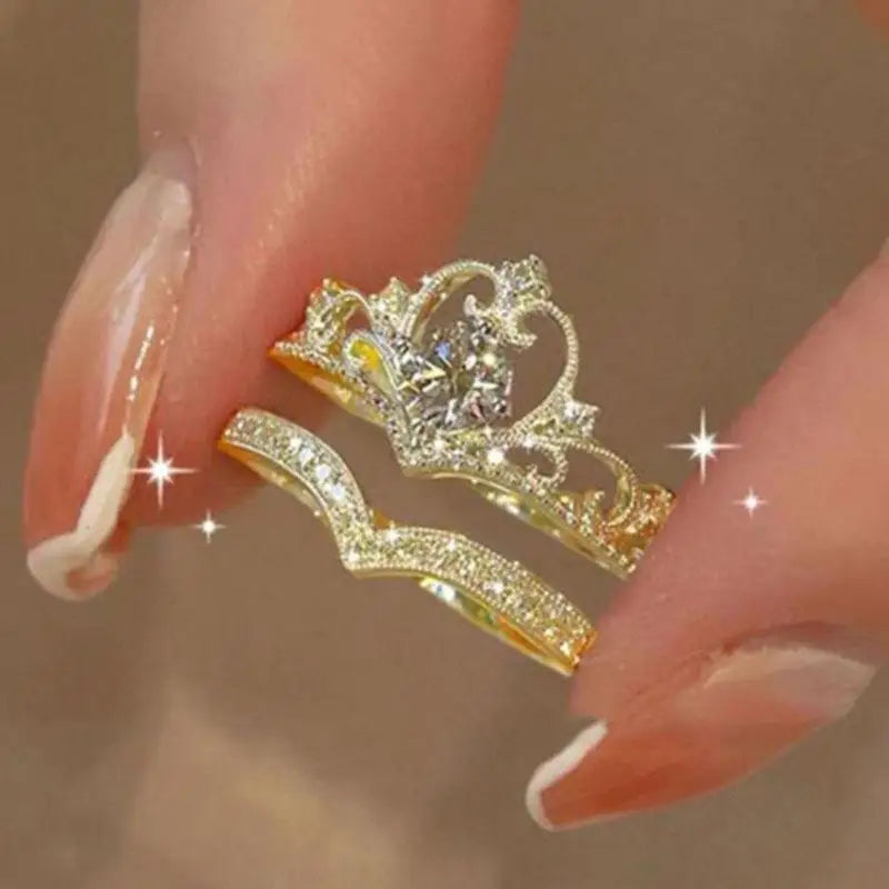 Gold tiara ring on a finger with a blurred background