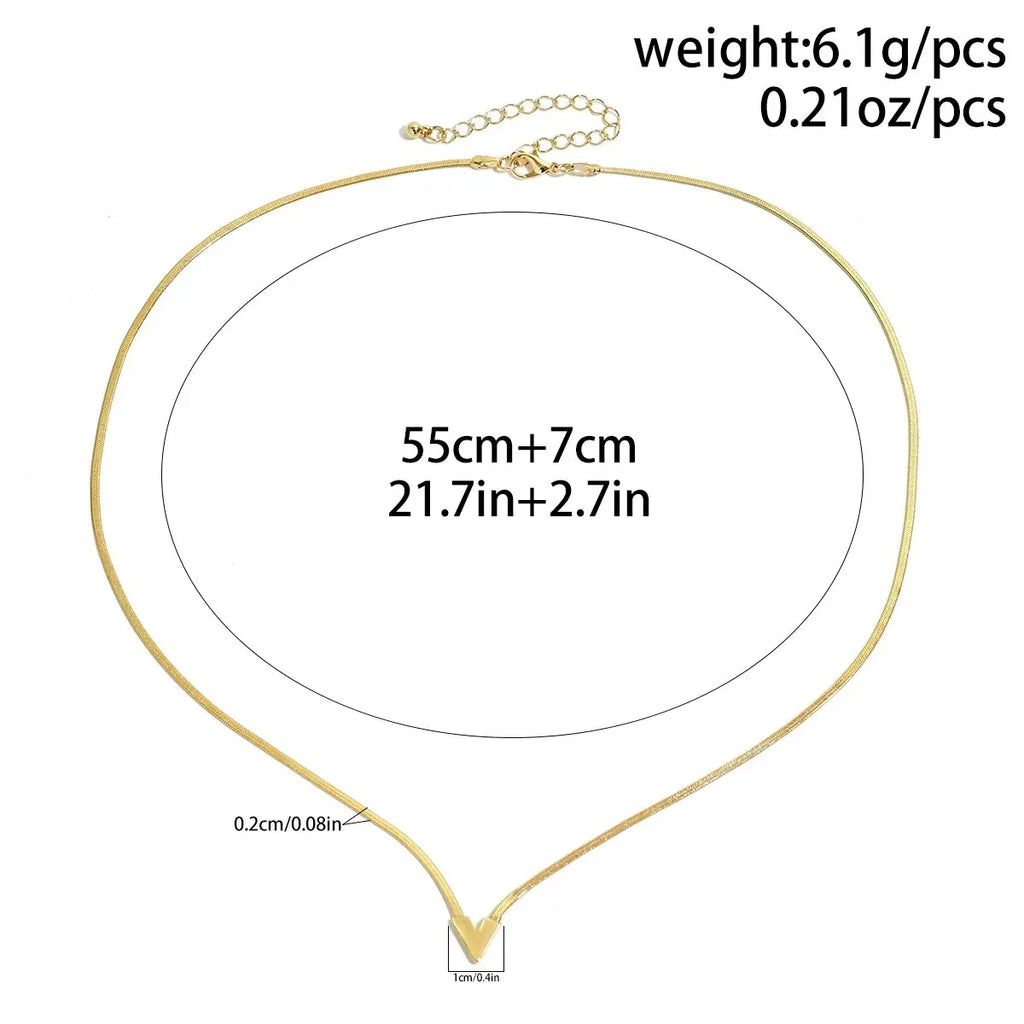 Gold necklace with measurement details on a white background