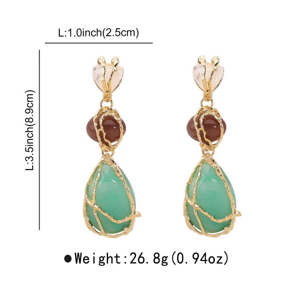 Gold earrings with green teardrop-shaped stones and brown round stones, shown with measurements and weight on a white background.